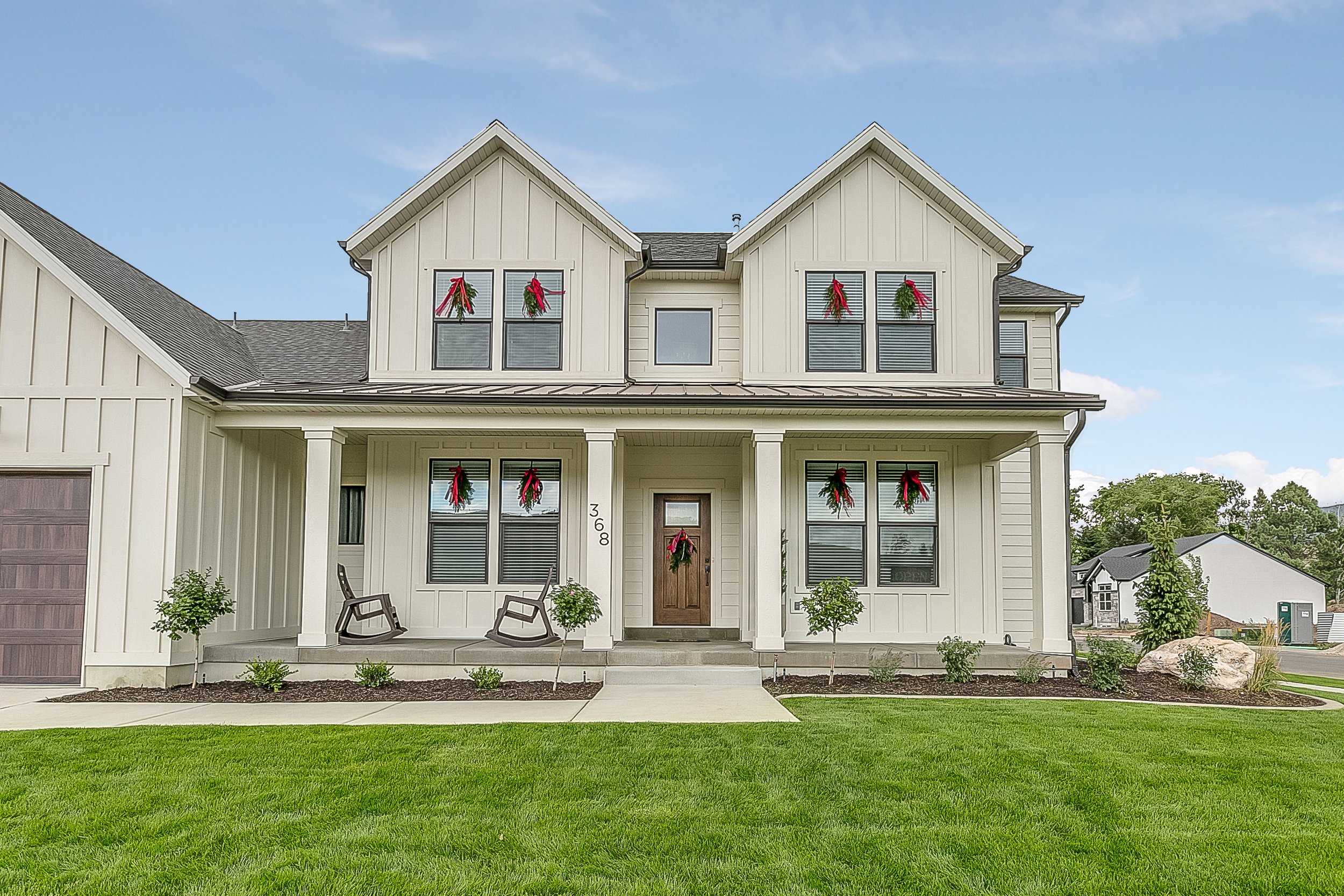 Beautiful modern farmhouse style exterior of showcase home