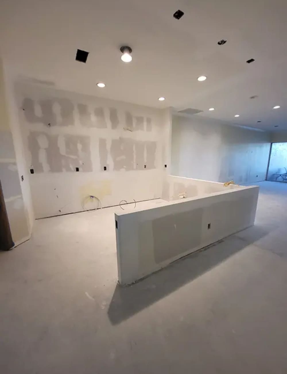 Damaged drywall and ceiling before professional repair and finishing.